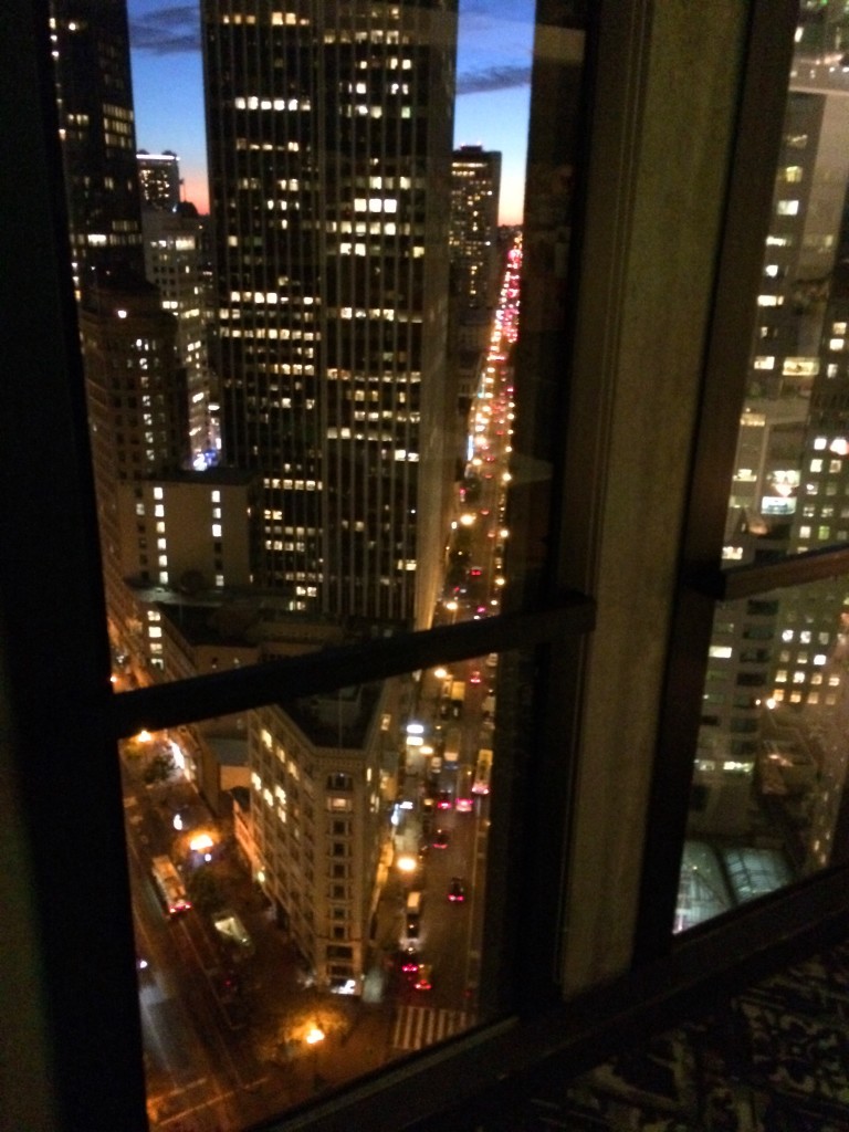 City lights through the window. The twenty-seventh floor is wayyy high up.