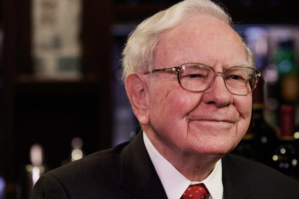 Warren Buffet, chairman and CEO of Berkshire Hathaway, looking pleased. Photo via Getty Images.